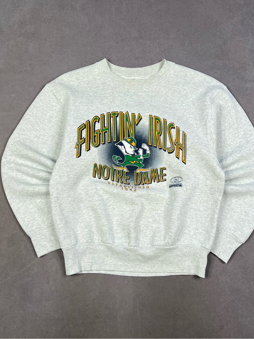 Vintage Gray Crewneck Sweatshirt with Green and Gold Notre Dame Graphic